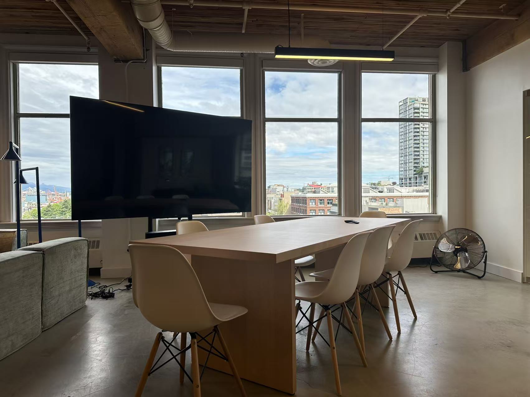 Large conference table with the 82-inch presentation display